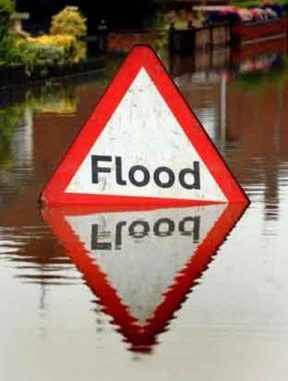 Fresh downpours and flood alerts create disruption across Britain